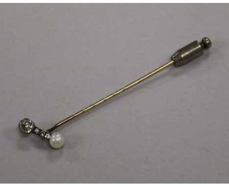 An early 20th century yellow metal, diamond and cultured pearl set stick pin, 74mm.