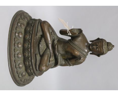 A Nepalese or Tibetan bronze seated model of Buddha