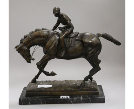 A bronze model of a jockey and horse height 34cm width 30cm