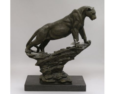 A bronze model of a mountain lion signed Pougatti by Talos Gallery on marble base height 39cm width 28.5cm