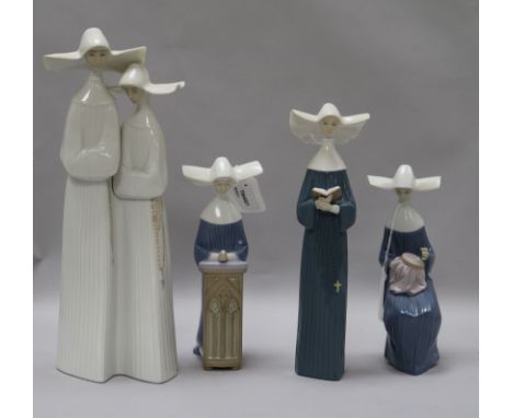 A Lladro group of two nuns and three other figures of nuns, one reading, one seated with sewing and one kneeling at prayer (4