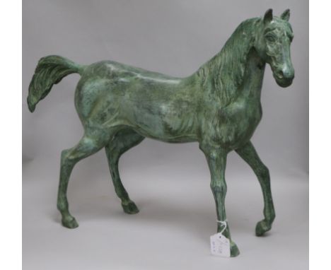 A green bronze model of a stallion height 47cm width 60cm