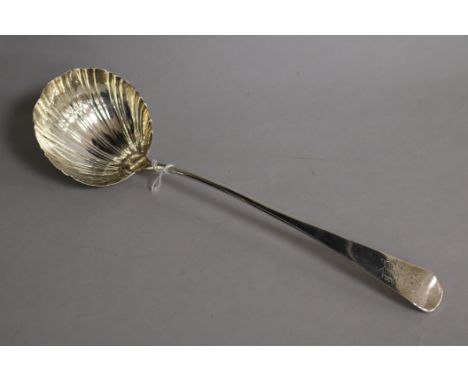 A George III silver Old English pattern scallop bowl soup ladle, 31cm.