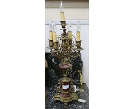 A pair of ormolu and marble candelabra and an ormolu mantel clock