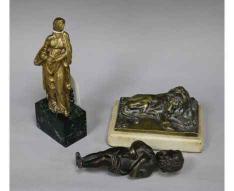 A Baroque or later gilt bronze figure of Virgin Mary, a bronze cherub and a bronze lion paperweight tallest 16cm