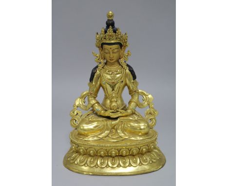 A Chinese gilt bronze seated Buddha height 23cm