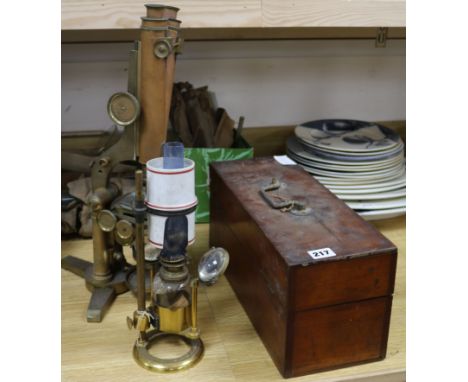 A Smith & Beck brass microscope, a bull's-eye condenser oil lamp, and a R & J Beck microscope and glass chemistry utensils mi
