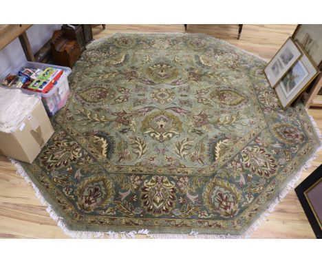 A Persian green ground octagonal carpet W.244 x 244cm