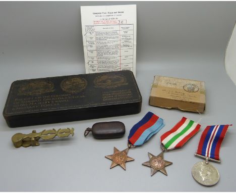 A gun metal sovereign case, a/f, a sovereign scale, a chocolate tin and three WWII medals, Italy Star, 1939-45 War Medal and 