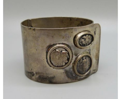 A large hinged bangle, marked 900, 114g 