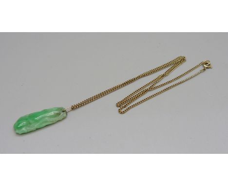 A carved jade pendant on a 9ct gold chain, chain 3.2g and 49cm 