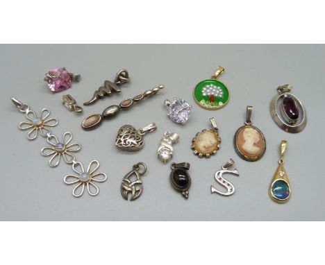 A collection of silver pendants including opal, moonstone, etc. 