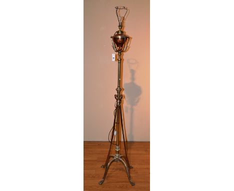 An Arts & Crafts style copper and brass stylized oil floor lamp, by Hinks & Son patenet, converted to electricity, 160cm high
