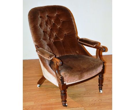 A late Victorian mahogany framed library armchair, upholstered in button back velour, 92cm high x 70cm wide