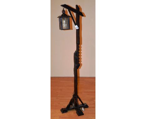 A lantern style wooden floor lamp, 171cm high