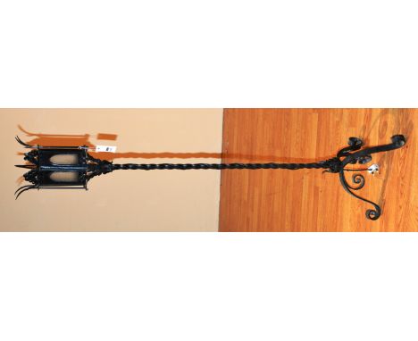 A wrought iron lantern type floor lamp, 145cm high