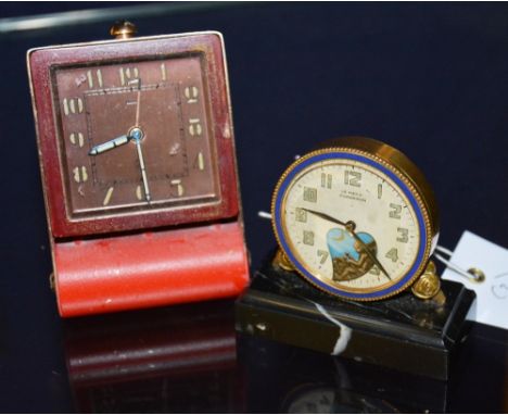 A travel alarm clock inscribed Jaeger, 9cm high, together with an alarm clock inscribed Le Petit Forgeron to verso (2)