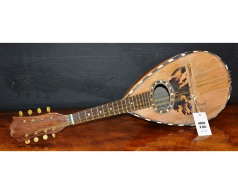 A late 19th century bow back mandolin, by Mario Casella, circa 1890-1900, 63cm long