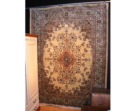 A machine made Keshan carpet, on beige ground, 280 x 200cm