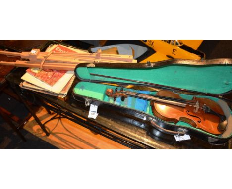 A Violin and bow, in fitted case, 55cm long, together with wooden music stands and music sheets (a lot)
