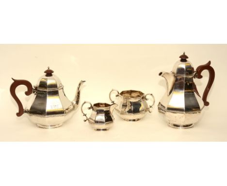 A silver four piece teaset by Walker & Hall, Sheffield 1936, comprising of water jug, teapot, sugar and cream, engraved to fr