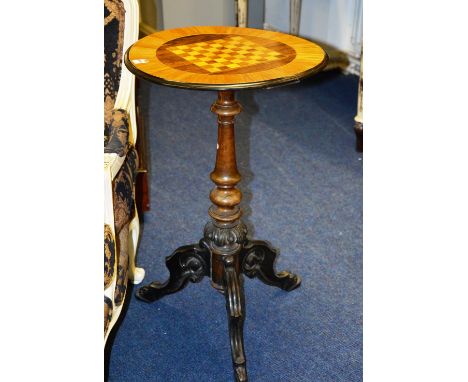 A Victorian satinwood and rosewood ebonised games table, with turned column and carved tripod base, 76cm high x 46cm deep