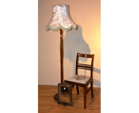 A floor lamp with shade, 189cm high, together with three matching mahogany dining chairs and a wall mirror (5)