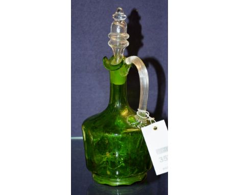 An early 20th century green glass decanter, with stopper, 27cm high