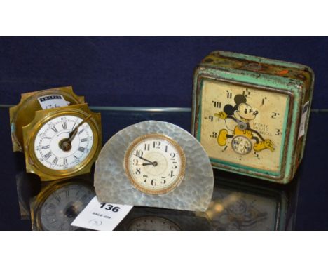A 1930's Mickey Mouse alarm clock by Ingersoll, 10cm high, together with an English pewter desk clock Swiss made, and a vinta
