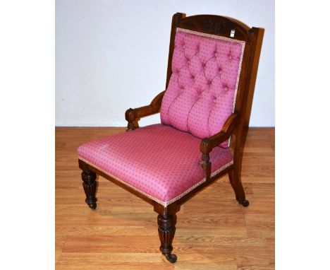 A late Victorian parlour armchair, upholstered in pale red button back fabric, 91cm high x 62cm wide