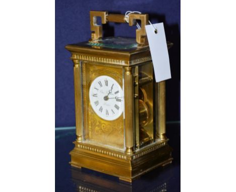 A brass and gilt carriage clock, with twin barrel and striking bell movement, named Chas Frodsham & Co London to dial, 21cm h