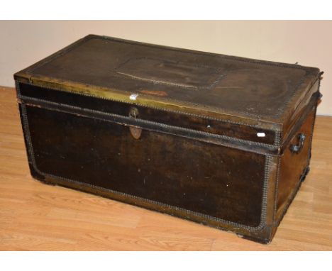 A black leather brass bound trunk, with studded detail and camphorwood lining, 49cm high x 104cm wide x 53cm deep