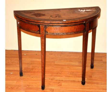 A George III style satinwood and mahogany banded demi-lune card table, raised on tapering supports with spade feet, 73cm high