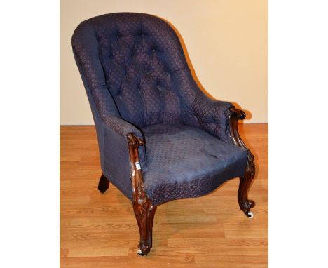 A Victorian carved mahogany button back armchair, 89cm high x 69cm wide