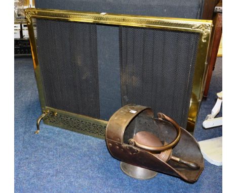 A brass firescreen, 79cm high x 87cm wide, together with a copper coal helmet with scoop (2)