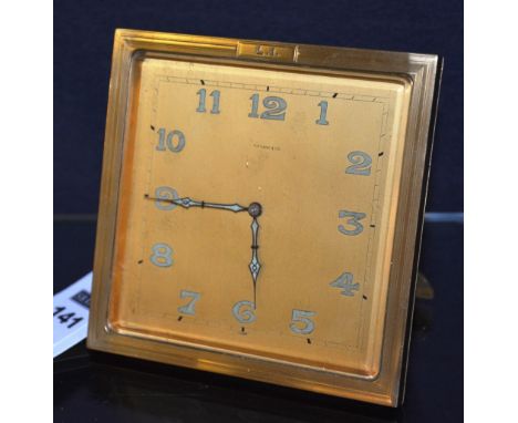 A gilt metal desk clock inscribed Tiffany & Co, stamped LI to top, raised on easel support, 13cm high
