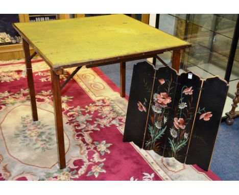 A vintage folding card table, together with a black painted floral wall panel, 73cm high x 88cm wide (2)