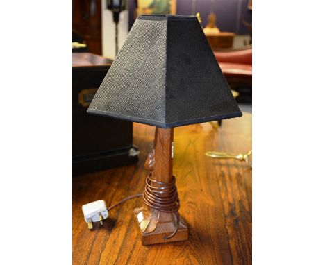 A Robert 'Mouseman' Thompson carved oak table lamp, with later black shade, converted to electricity, lamp 27cm high CONDITIO