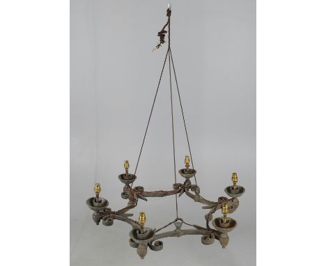 
	
		A wrought iron six light chandelier loosely in Medieval taste, 61cms wide.
		
		Condition Report: 
		looks to have had e