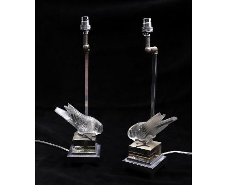 
	
		Lalique, a pair of Moineau pattern glass paperweights, now adapted into lamp bases, the sparrow modelled with head down,