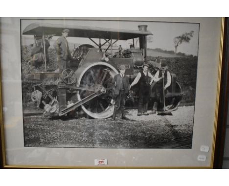 A vintage photographic print of a steam road roller with four crew. Framed and glazed 67cm x 54cm.