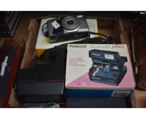 Three assorted vintage cameras, a Polaroid Supercolour 645 CL, A Kodak EasyShare C433 and a Olympus SuperZoom 115.