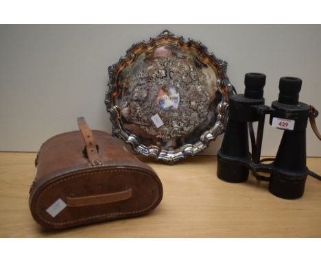 A pair of vintage field binoculars with leather case and a scalloped silver plated tray (engraved).