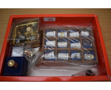 A small selection of assorted metal and ceramic thimbles including two Royal Crown Derby 'Imari' pattern.