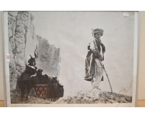 A framed photographic print of Goatherd at Tashkurghan Afganistan measuring 42cm x 60cm