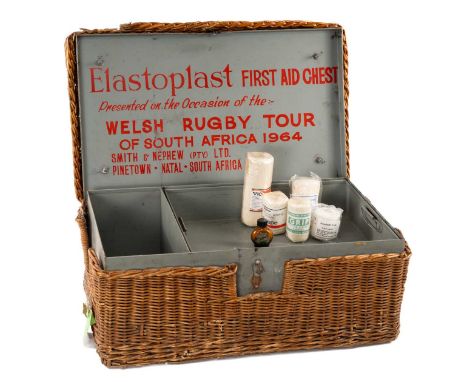 1964 WALES-SOUTH AFRICA RUGBY TOUR FIRST AID CHEST, painted grey metal box with removeable tray and wicker exterior, inside l