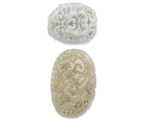 TWO CHINESE CARVED AND PIERCED JADE PENDANT PLAQUES, one depicting a pair of cranes within a foliate frame, 7cm by 5.5cm; the