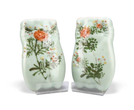 A PAIR OF CHINESE CELADON WALL POCKETS, amorphous form and painted with sprays of flowers. (2) 15cm by 9.5cmCONDITION REPORTB