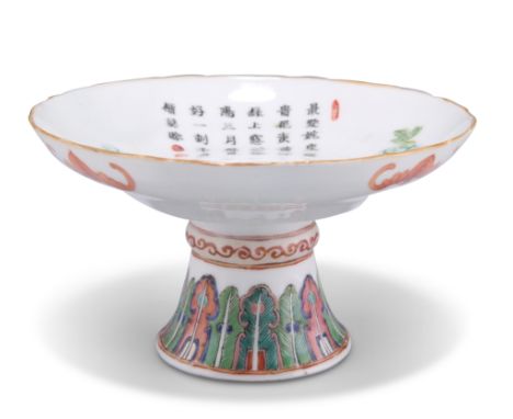 A KANGXI-STYLE FAMILLE VERTE FOOTED DISH, enamel painted with blossoming boughs and a band of stiff leaves. 14cm diameterCOND