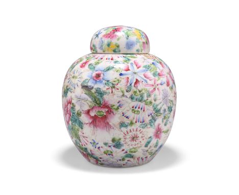 A CHINESE FAMILLE ROSE GINGER JAR AND COVER, painted with millefleur, bears iron red six character mark. 19cm highCONDITION R